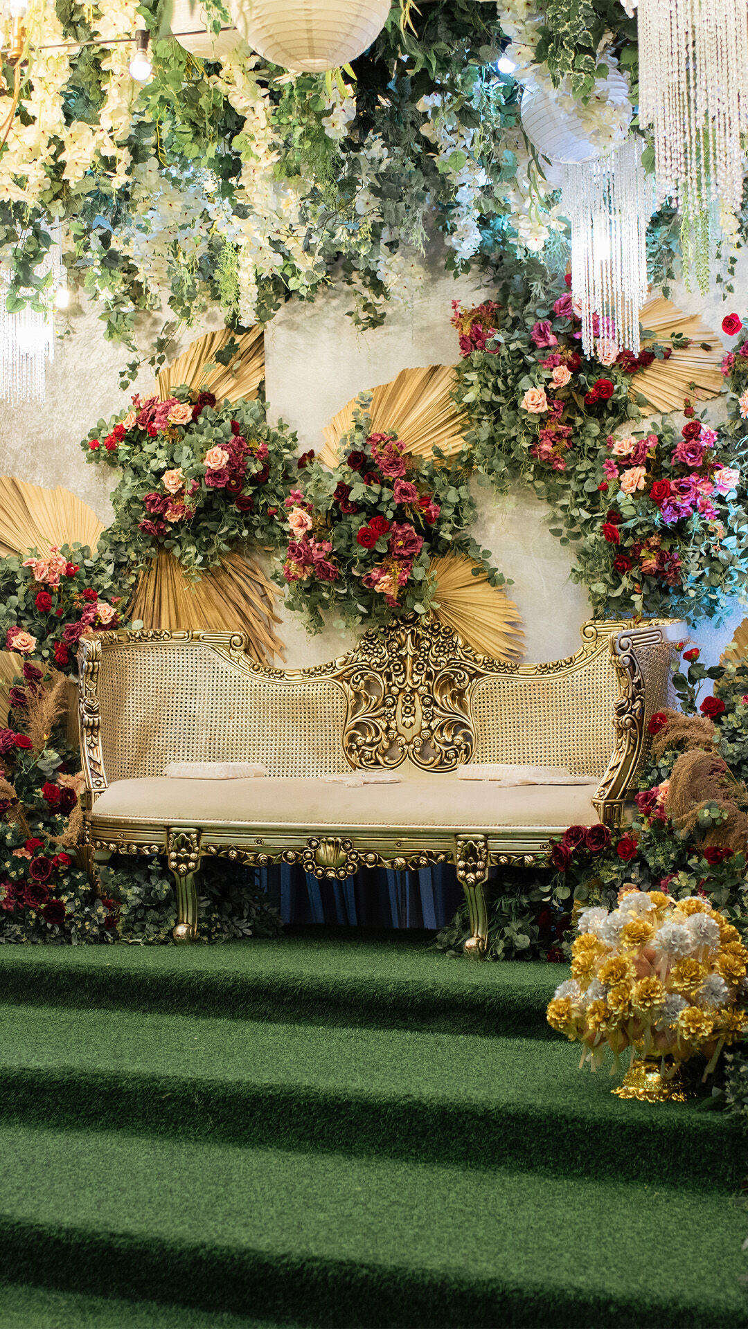 Bright and elegant mehendi decoration with an array of colorful flowers.
